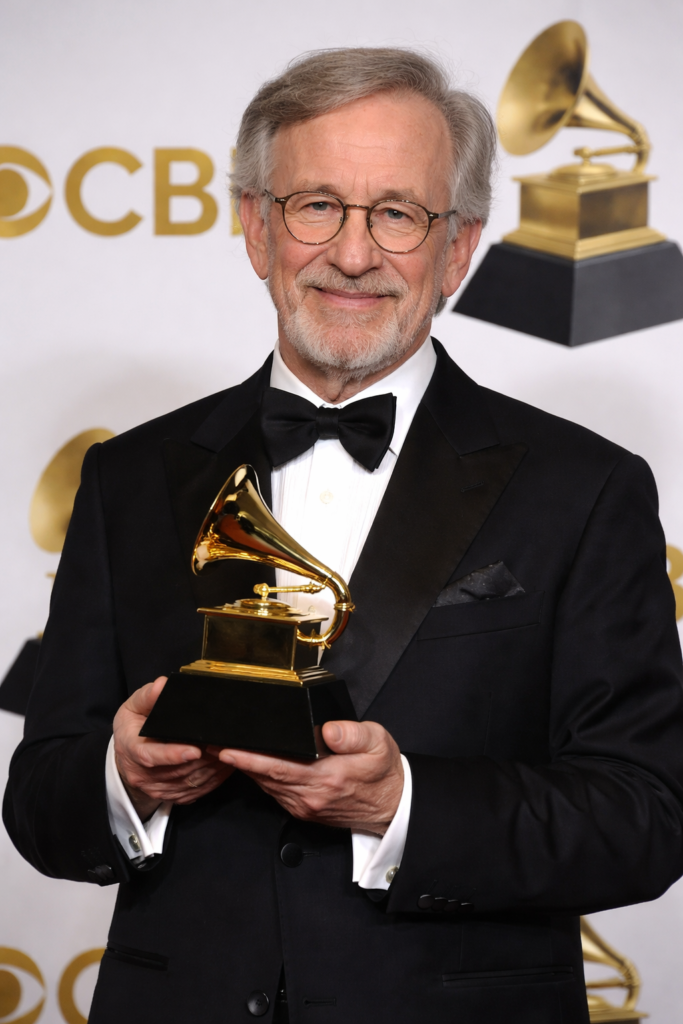 AI-generated image of Steven Spielberg holding a Grammy trophy.