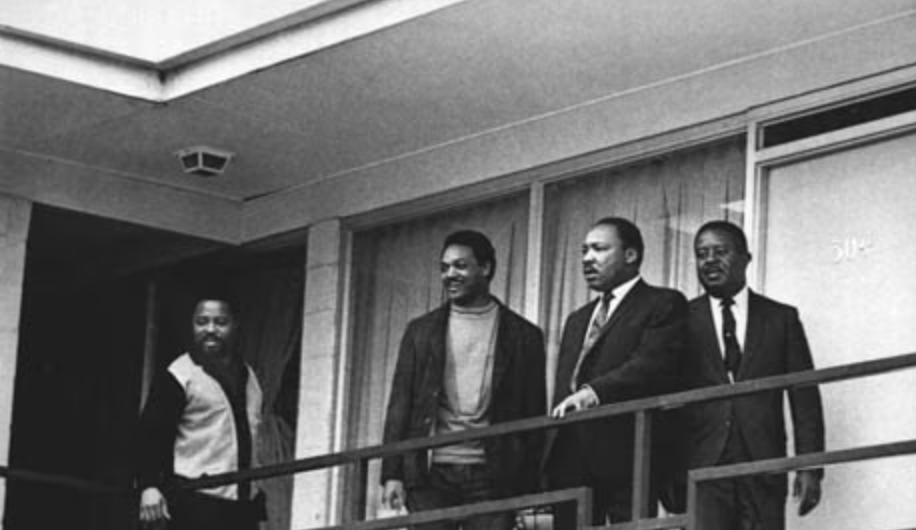 Jesse Jackson standing with Martin Luther King Jr. on the balcony of the Lorraine Motel