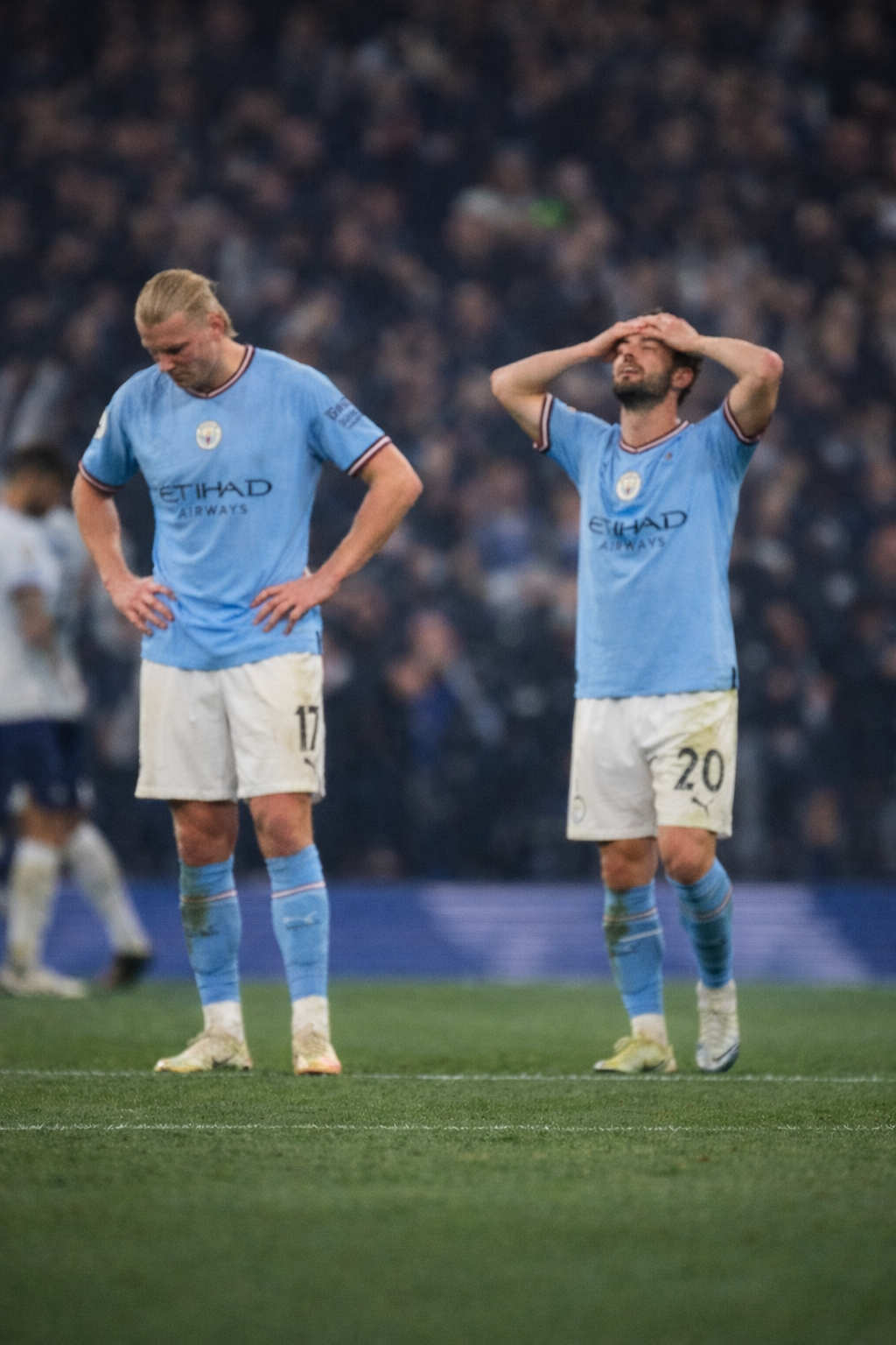 Manchester City players show disappointment after blowing a two-goal lead in a 2–2 Premier League draw against Tottenham Hotspur