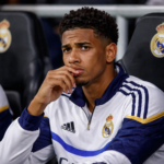 Jude Bellingham looking frustrated on the bench during a Real Madrid match