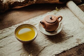 Steaming green tea in a traditional ceramic bowl