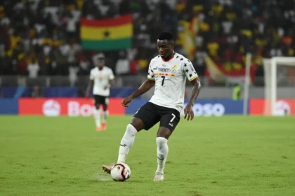 Caleb Yirenkyi controlling the ball in a Ghana national team kit