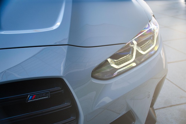 A modified BMW M4 by AC Schnitzer parked in a high-tech German garage